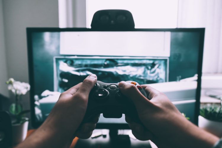 Video Game Tester Jobs: gamer in front of TV